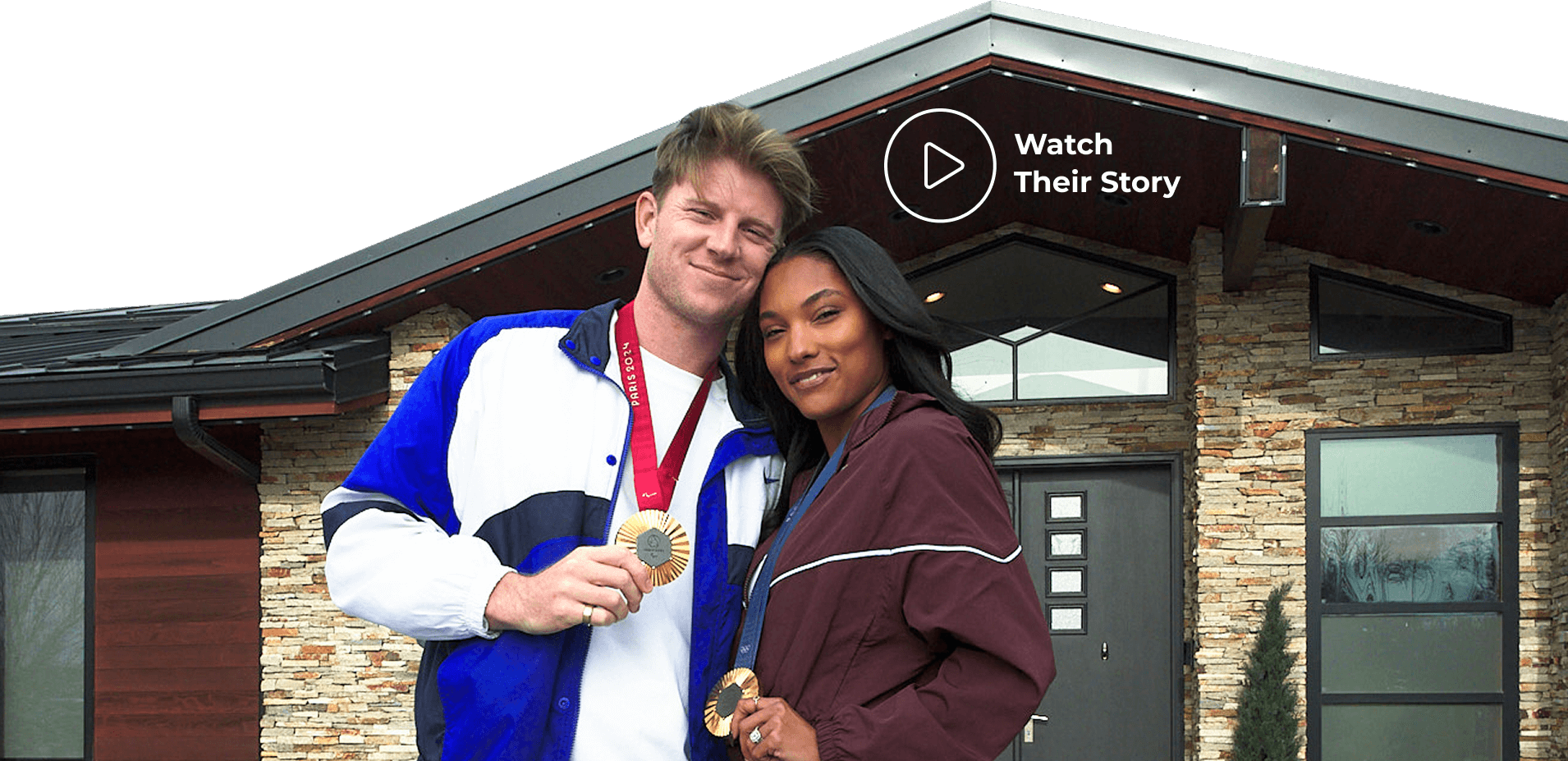 Woodhalls stand in front of their home